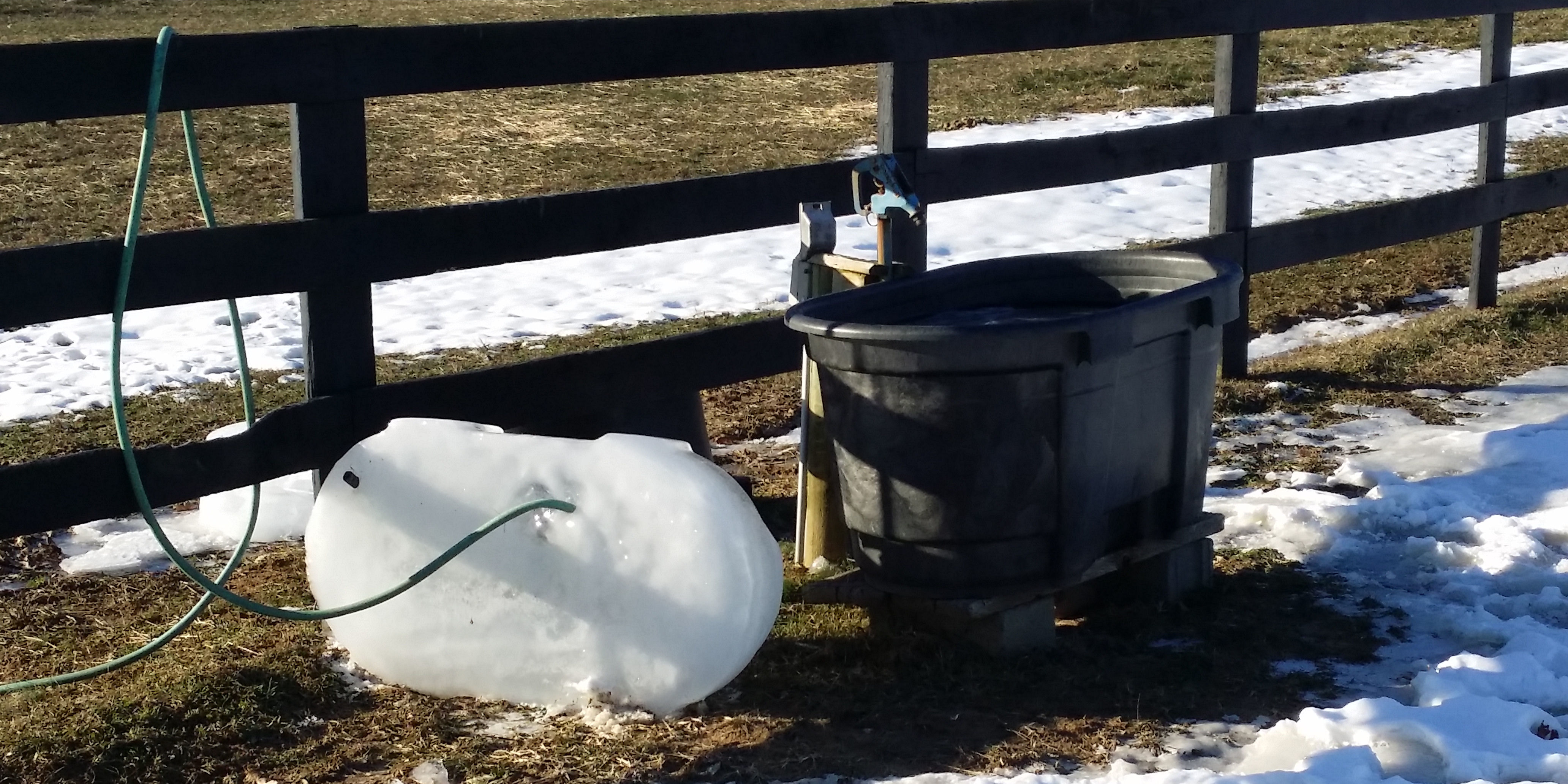 An ice block removed from a water trough.