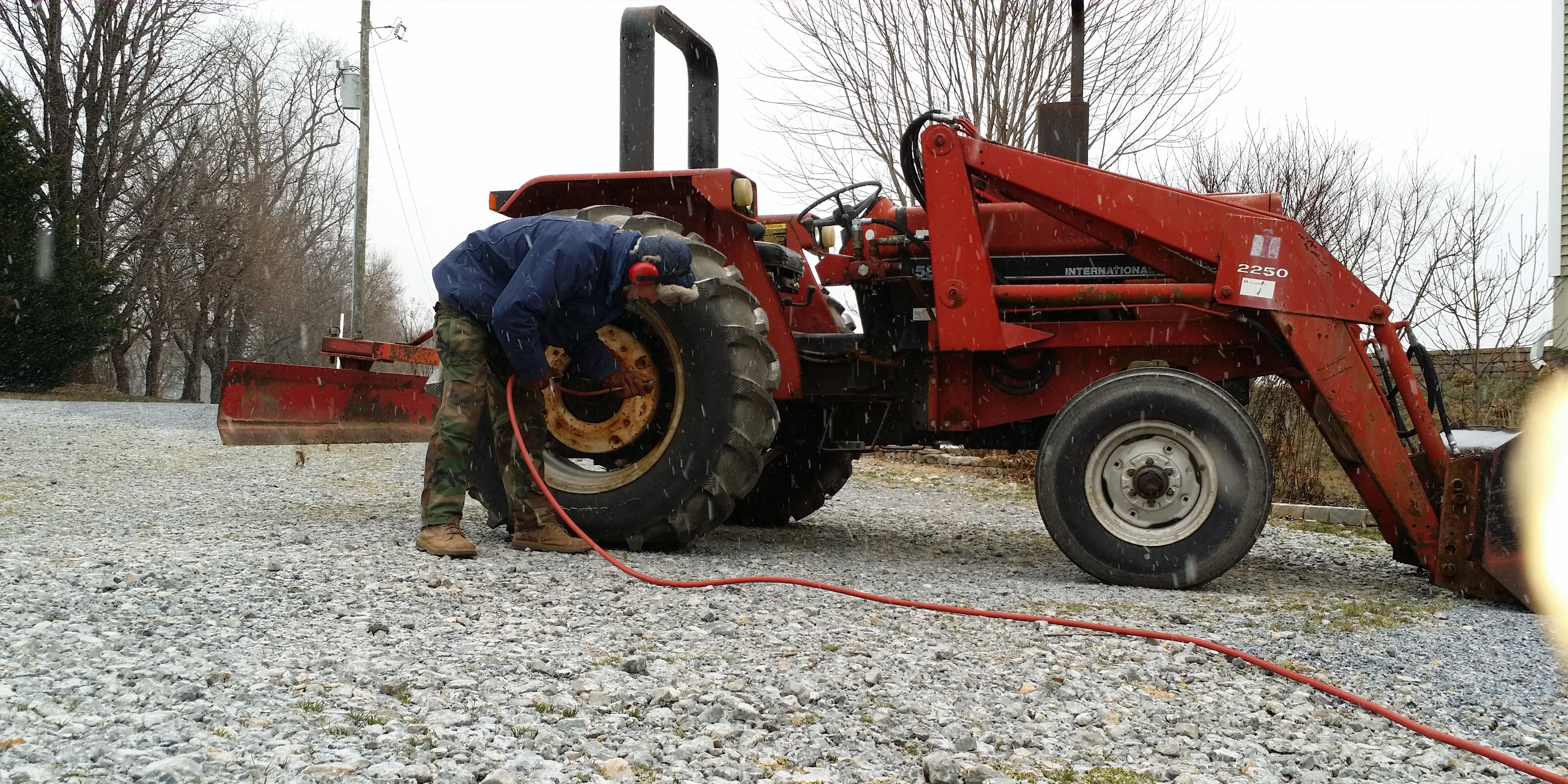 Pat preparing the tractor before a snow storm